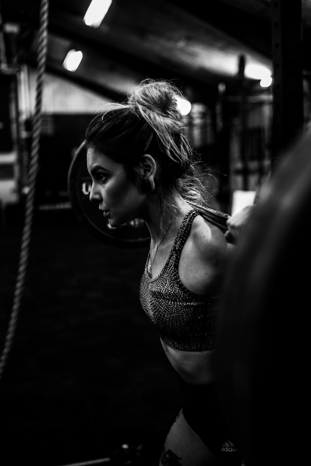 greyscale-photo-of-woman-in-bralette-inside-room-5ubiqv58cw8